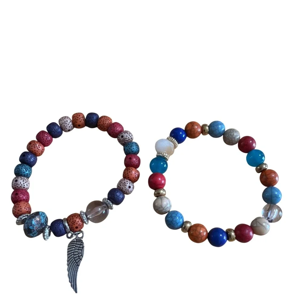 Set of 2 Multi Color Beaded Stretch Bracelets  Silver Wing Charm